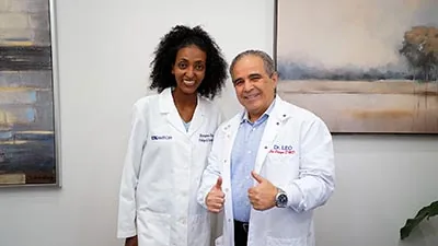 Dr. Leo and Dr. Baye of Dental Images of Gwinnett giving a thumbs up for the camera